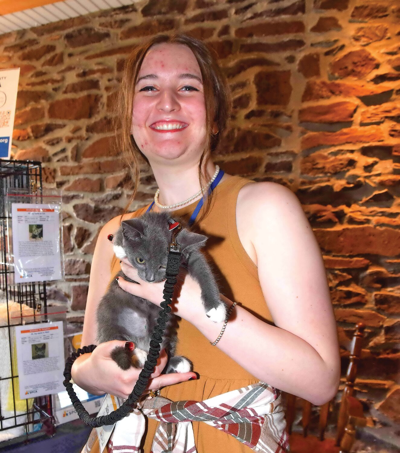 Kira Sullivan with adoptable kitten Abel.