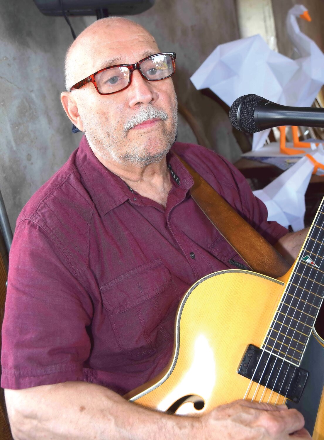 A guitarist provides music at the Barn Bash.