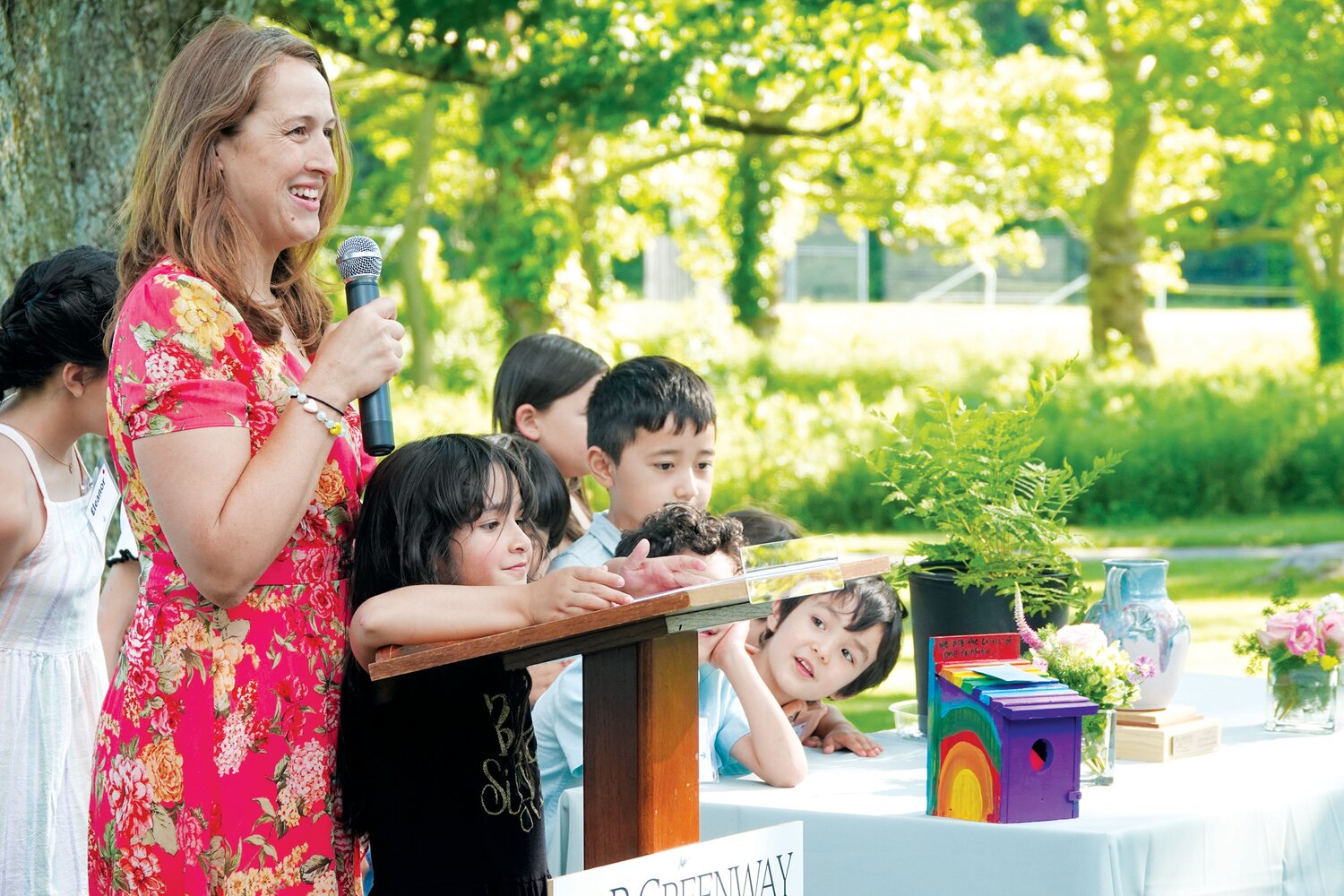 The young families of Bahá’í showed off colorful birdhouses that served as word boxes for guests to share their thoughts on preserving and caring for land.