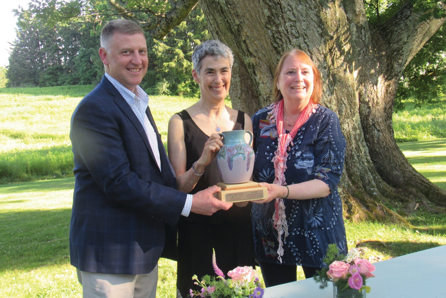 D&R Greenway board chairman Michael Kunst, left, and President and CEO Linda Mead, right, present the Donald B. Jones Conservation Award to Liz Cutler at D&R Greenway’s 35th Anniversary Gala.