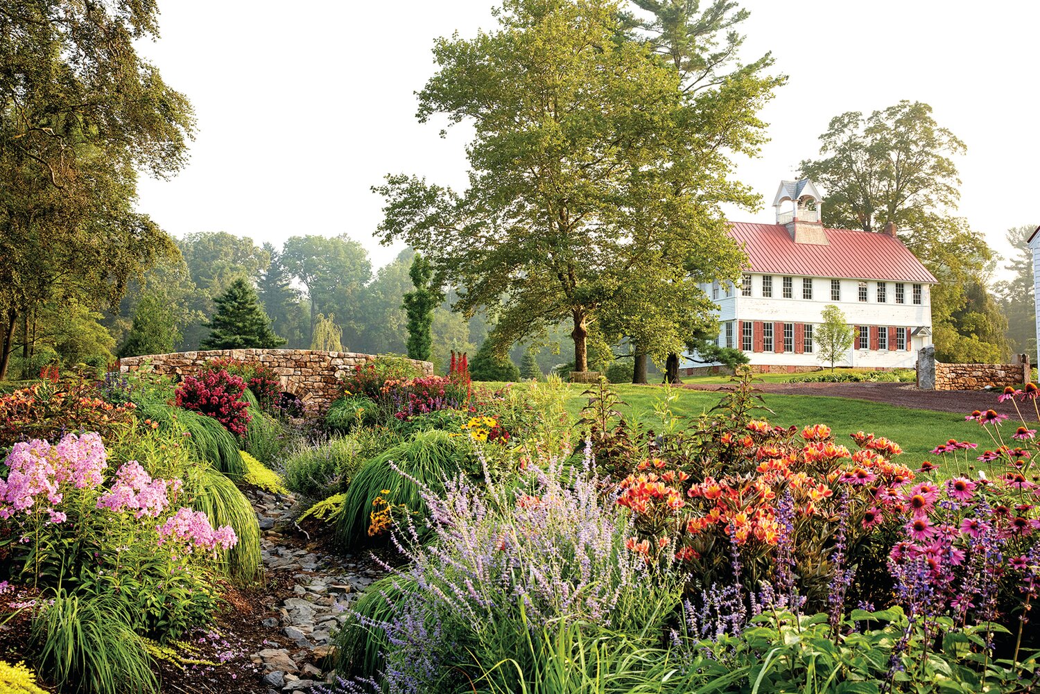 Flowers line the creek bed at Fordhook Farm in 2023.