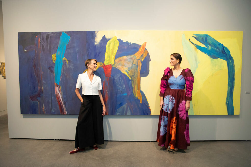 Anne Francey and Suleika Jaouad in front of one of Francey’s paintings.