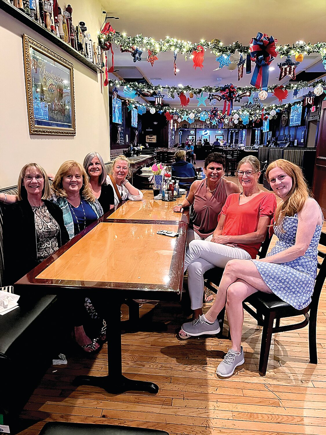 Shelly Steely, second from right, gets together with friends at Morrisville Tavern during her annual visit home to the United States in 2022.