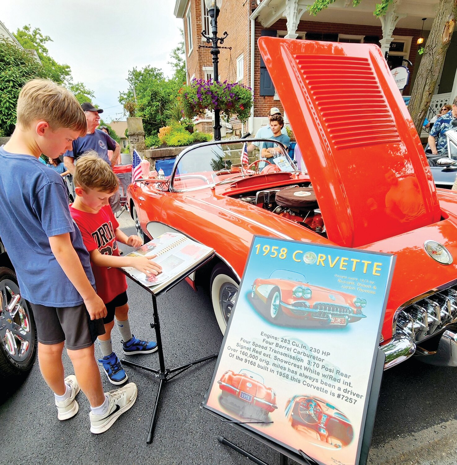 Ashton and Parker Burke of Furlong check out a 1958 Corvette owned by Russell Thomas, member of the Corvette Club of the Delaware Valley.