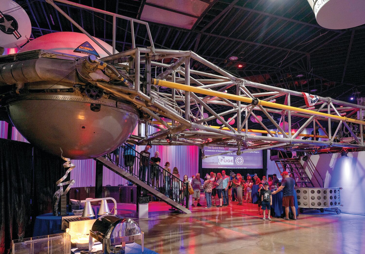 A line of visitors form to enter the centrifuge.