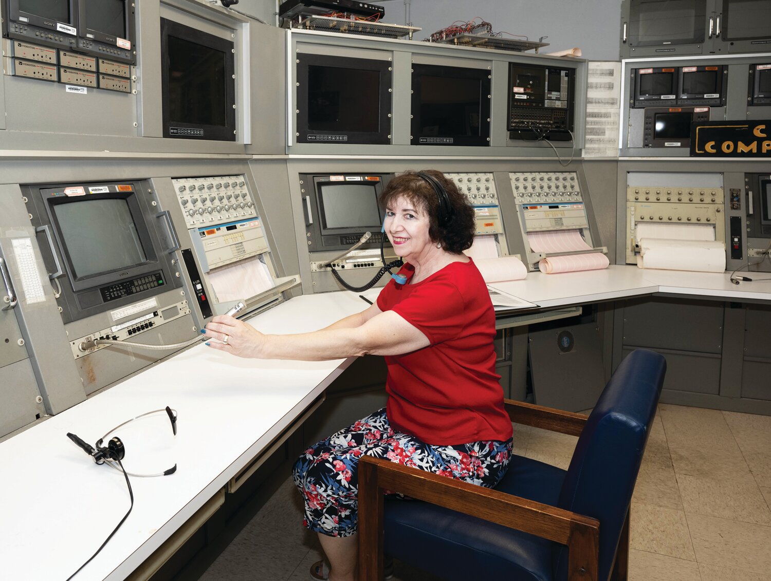 Maria Williams poses at the centrifuge computer control center.