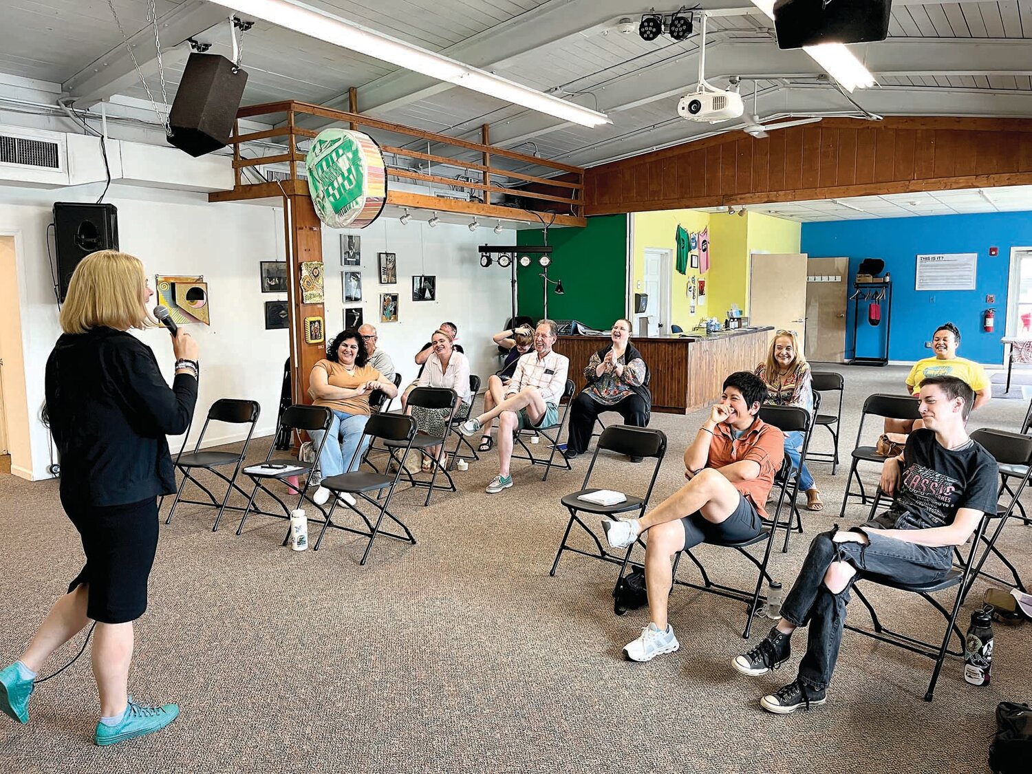 Megan Henninger, founder of Women’s Comedy Open Mic, gets laughs from participants at last week’s event.