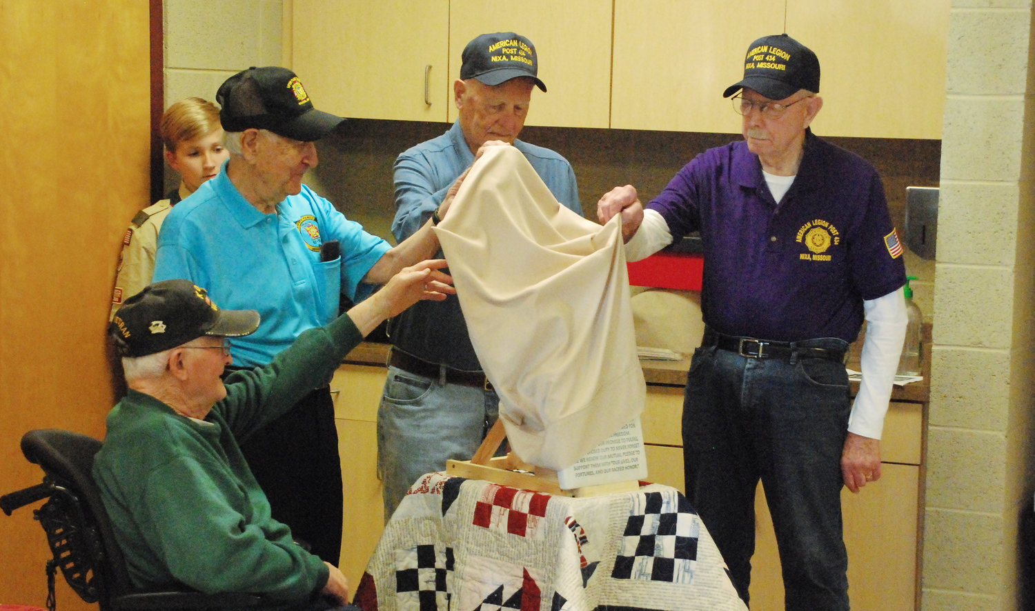 FOUR KOREAN WAR VETERANS unveil a monument for unknown and unidentified soldiers that will be placed at the Veterans Memorial at the Nixa Community Center. The unveiling took place as part of Veterans Day ceremonies at the X Center on Nov. 13, 2021.