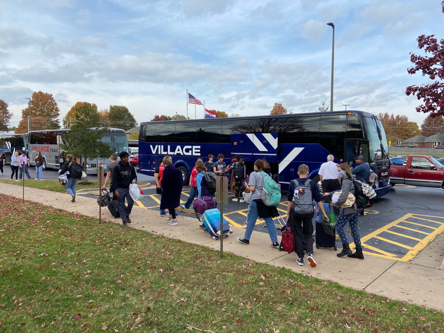 NIXA HIGH SCHOOL BAND STUDENTS load up on tour buses on Nov. 10, to head to the Grand Nationals competition in Indianapolis, Indiana.