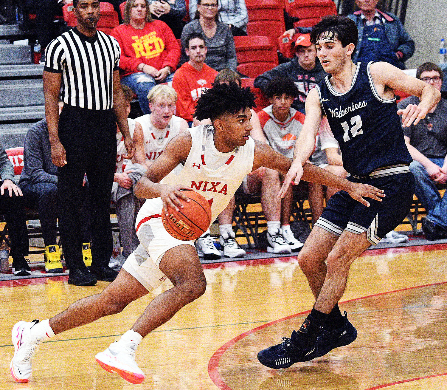 NIXA’S KAEL COMBS makes a move to the basket versus Bentonville West on Friday.