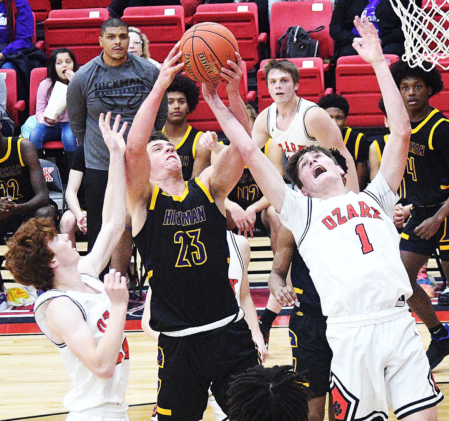 OZARK’S JACE WHATLEY fights for a rebound.