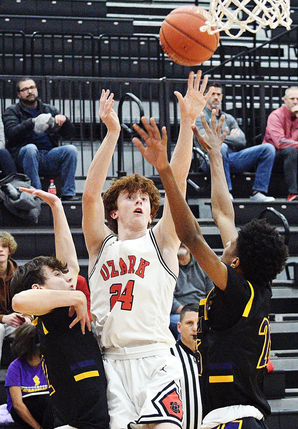 OZARK’S DEVYN WRIGHT shoots for two of his five points.