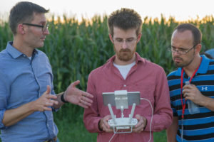 Matt Waite instructs a pair of journalists on how to fly a drone at the first ever Drone Journalism Boot Camp this past August. The boot camp, sponsored by the Google News Lab, trained 62 journalists on new FAA requirements for drone pilots and how those rules impact newsrooms.