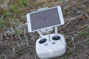 A DJI Phantom 4 controller sits awaiting a connection to the drone before a demonstration flight at a University of Nebraska-Lincoln farm at the first ever Drone Journalism Boot Camp. 