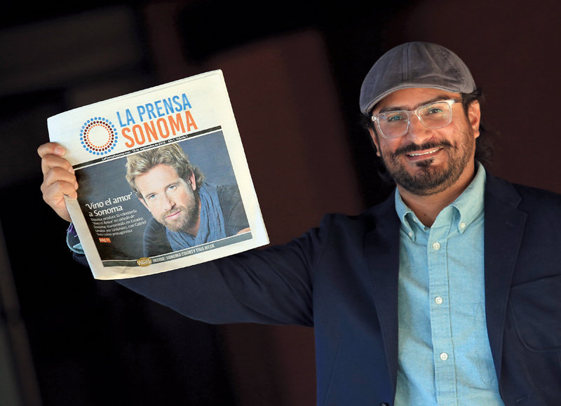 La Prensa Sonoma editor Ricardo Ibarra with the first print edition of the newspaper.