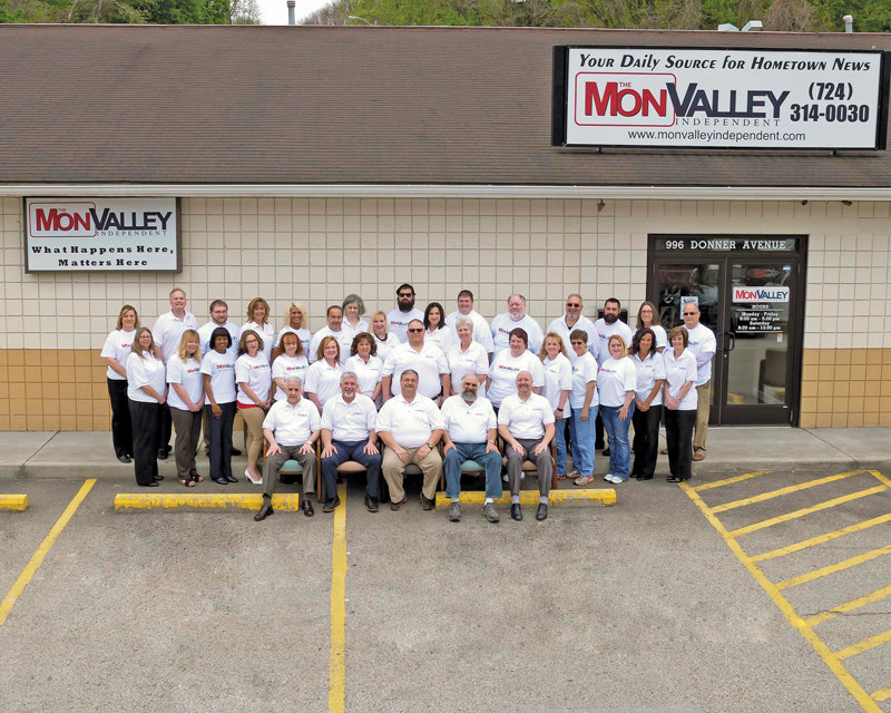 The entire Mon Valley Independent staff and its local ownership group outside of the paper’s new building.