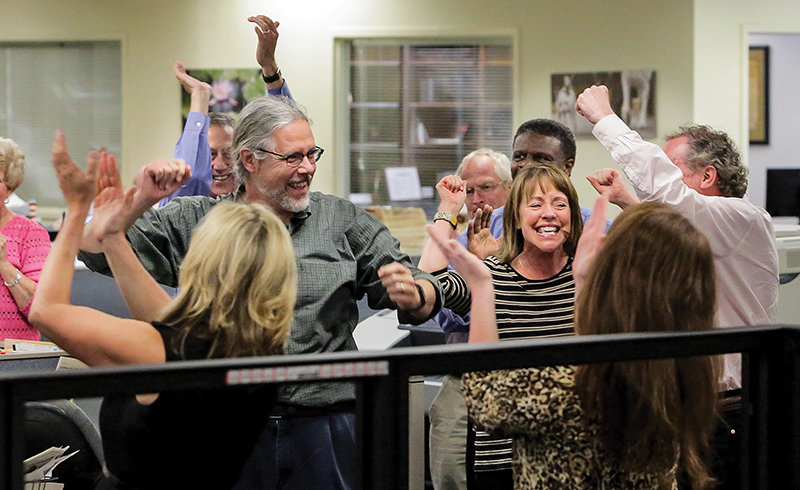 The Post and Courier cheer in the newsroom last year as they find out they’re the winners of the Pulitzer Prize in Public Service. (Photo by Grace Beahm/Post and Courier) 