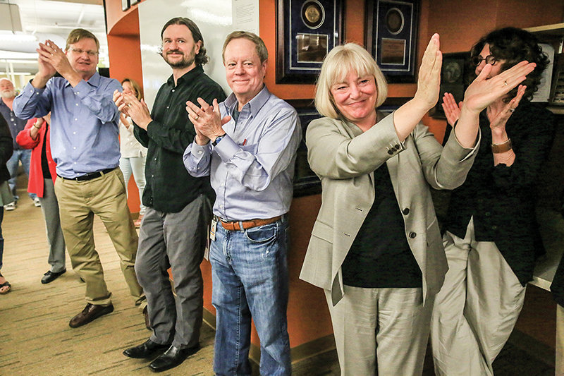 Richard Wagoner, metro editor; Ryan Blethen, assistant managing editor, digital; Frank Blethen, publisher; Kathy Best, editor; and Alayne Fardella, president and chief operating officer, applaud the newsroom after The Seattle Times wins the 2015 Pulitzer Prize for Breaking News Reporting. (Photo by Erika Schultz/The Seattle Times)