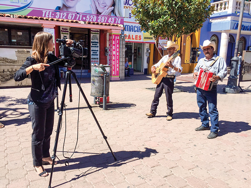Cronkite School of Journalism student Erica Lang records musicians in Nogales, Mexico.
