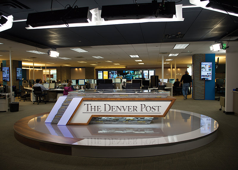 A shot of the Denver Post newsroom with the DPTV anchor desk in the center.