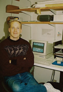 Schult in front of his old Mac LC, building ad stacks with an early ad dummying program, circa 1988-92 at The Acorn Press in Ridgefield, Conn.