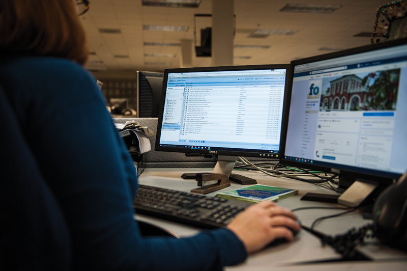 Beth Hutson, the digital and print production team leader at the Fayetteville Observer, working in the paper’s web CMS. (Photo by Shane Dunlap/Fayetteville Observer)