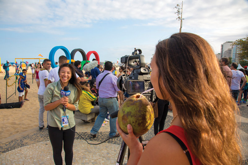 Cronkite student Jaclyn Chung (left) does a report on camera with fellow student Kristina Vicario. 