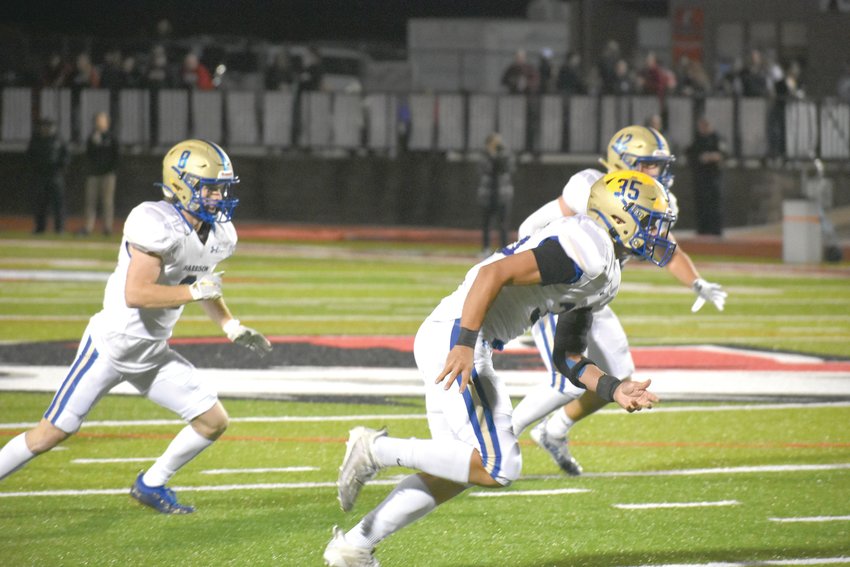 Friday night Harrison took a step toward the Class 5A State Football Playoffs with a win over Clarksville, 35-3. Harrison's defense (from left) Phoenix Whitney, Caden Robertson and Tristan Thompson move to the football.