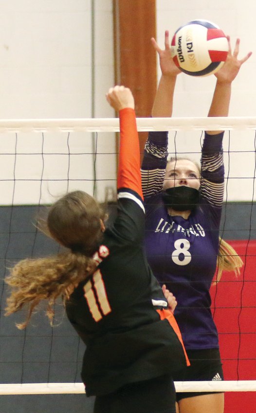 Litchfield's Emma Walch gets a block on Tatum Christian's hit during the Panthers' three-game win over Hillsboro on Monday, Oct. 25, at the Carlinville Regional.