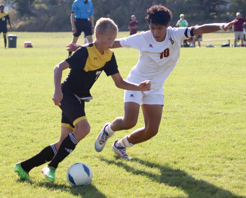 Noah Fast of James Valley Christian attempts to get past Justin Escobar of Freeman Academy during their boys’ soccer game Tuesday at JVC Field.