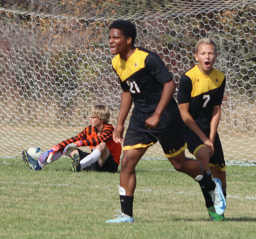 Gavin Waldner (21) and Noah Fast celebrate James Valley’s second goal as Bobcat goalkeeper Simon Wiersema sits on the ground.