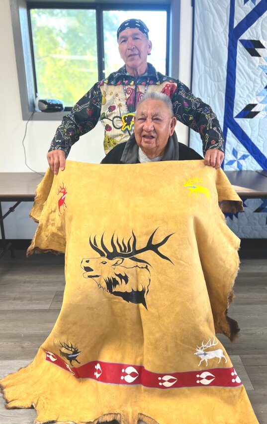 Reverend Clifford Canku of Sisseton, who has dedicated nearly his entire life to ministry, attended Flandreau Indian School as a boy and later graduated from the University of Minnesota, Morris. He has served as an instructor with the Dakota Presbytery, frequently returning to Flandreau to lead classes and serve in a leadership role for the church as a whole. During his recent visit, artist Mike Weddell gifted him an elk quilt to be used for his burial.