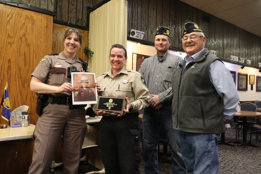 State Trooper Shelby Hattum was awarded Outstanding Law Enforcement Officer of the Year. State Trooper Joelle Schuknecht and Sheriff Jenna Appel stand up in Hattum’s place.