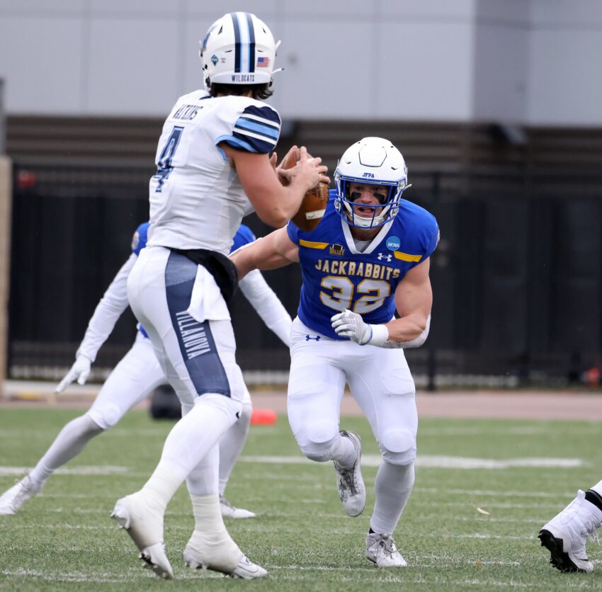 Adam Bock #32 of the South Dakota State Jackrabbits eyes quarterback Connor Watkins #4 of the Villanova Wildcats at Dana J. Dykhouse Stadium on Dec. 9 in Brookings.