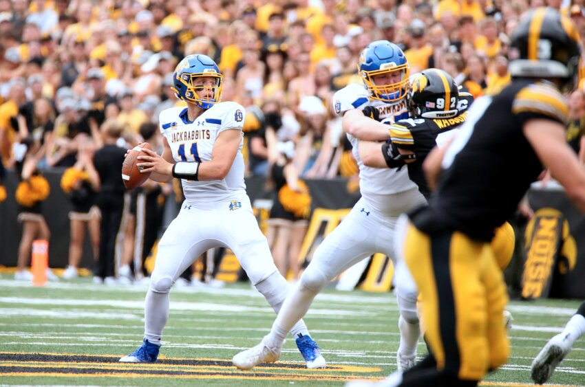 Mark Gronowski (#11) of the South Dakota State Jackrabbits looks for a receiver against the Iowa Hawkeyes at Kinnick Stadium on Sept. 3, 2022, in Iowa City, Iowa.