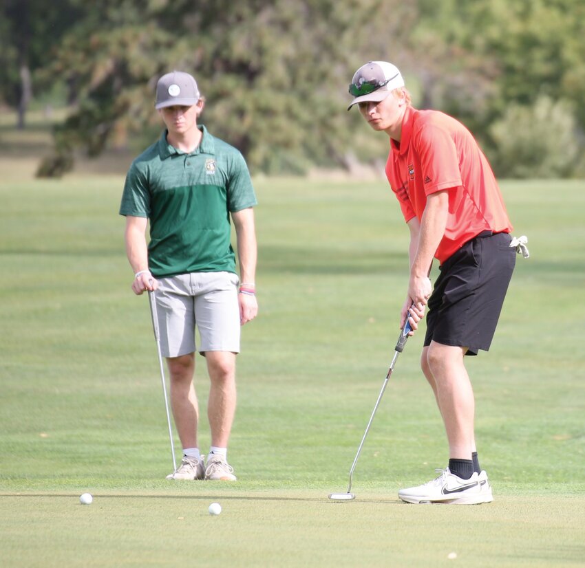 Huron’s Riley Jankord putts on the 18th green at the Brookings Country Club during the Bill Scholten Invitational on Monday morning.