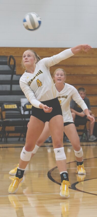 Brynlee Landis and Elaina Rhode watch a one armed dig go over the net.