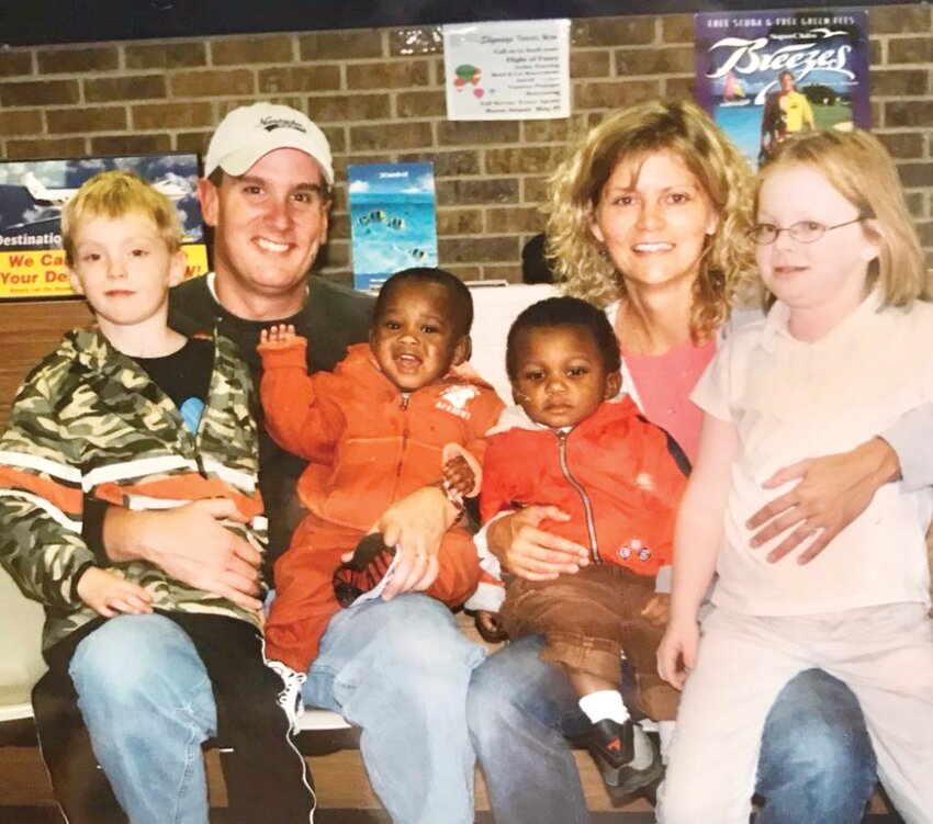 The first family photo taken in Florida after Steve and Kris Gohn adopted Marrien, with Riley, Payson and Maddy.