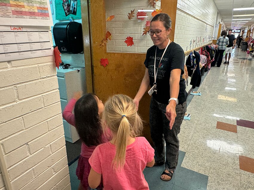 Teacher Sarah Gross greets students before class on Oct. 11 at South Park Elementary School in Rapid City.