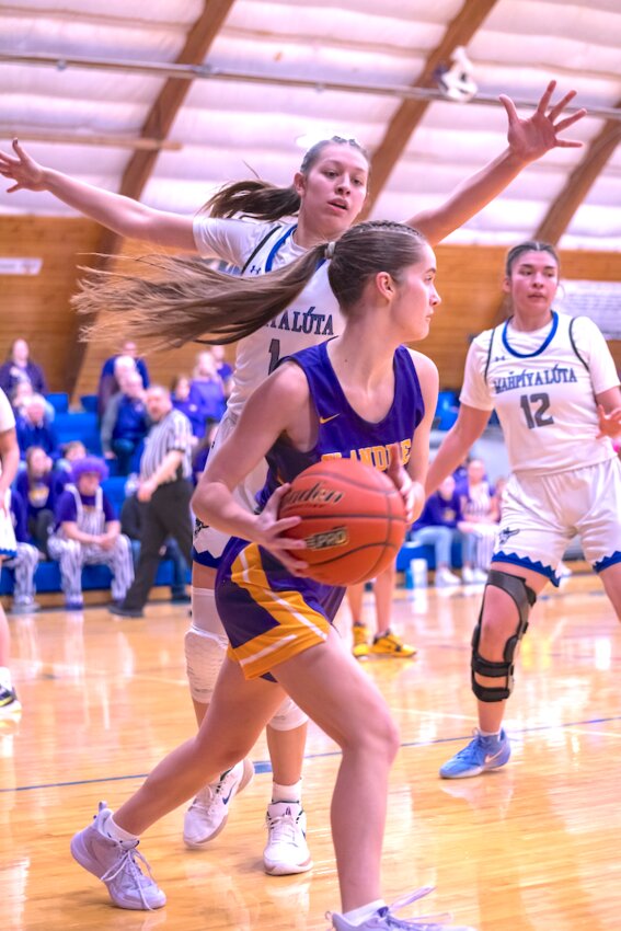 Josie Hamilton looks for an open Flier to pass the ball.