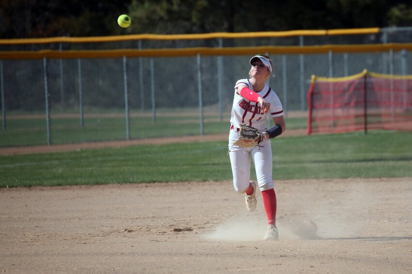 Brookings' Morgan Norgaard throws the ball to first base during a 12-6 to Harrisburg on Tuesday afternoon in Brookings