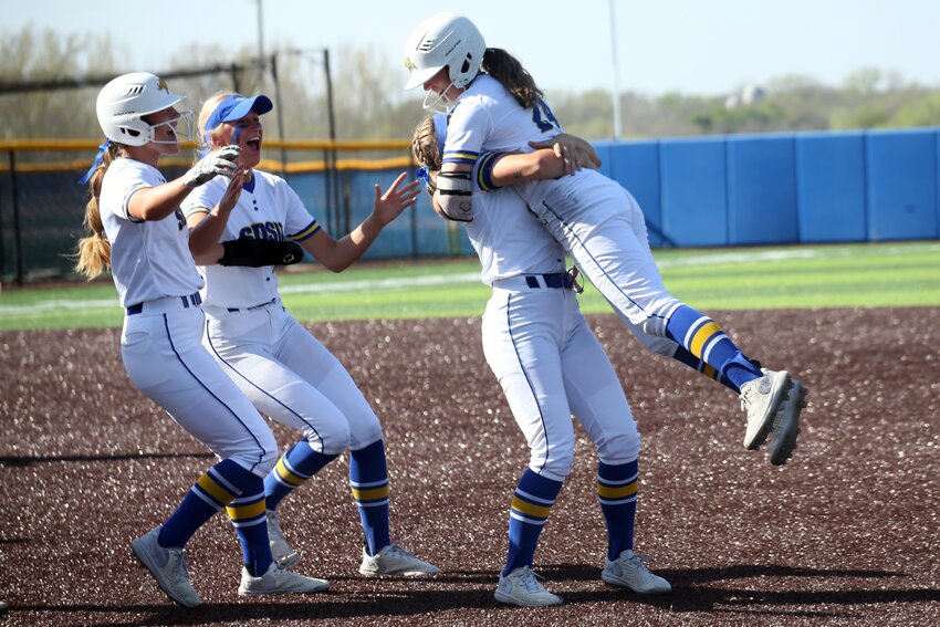 South Dakota State’s Abby Gentry, right, celebrates with teammates after hitting a game-winning single in the 13th inning of a game against South Dakota in the Summit League Tournament on Thursday afternoon at Jerald T. Moriaty Field in Brookings. The Jackrabbits won the game 6-5 and play Omaha on Friday at 1 p.m. in Brookings.