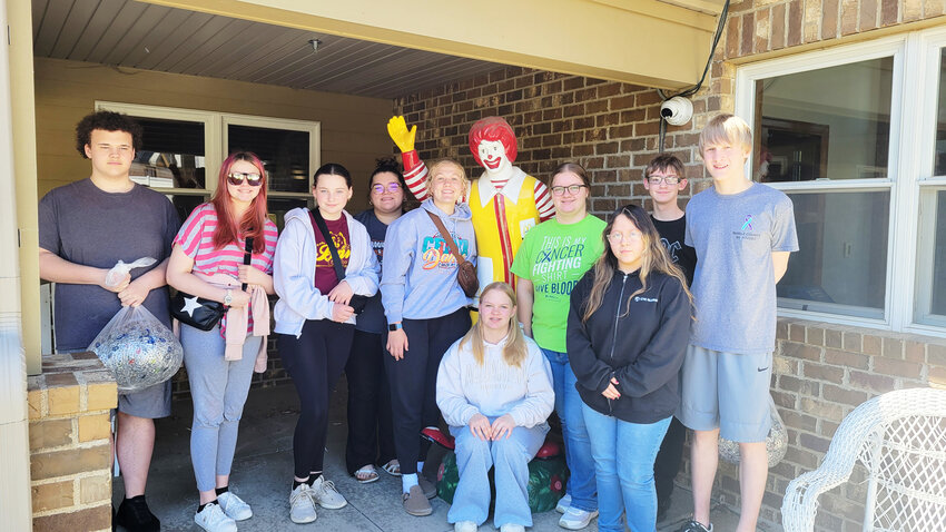 FCCLA members stand in front of the Ronald McDonald House with the collected tabs.