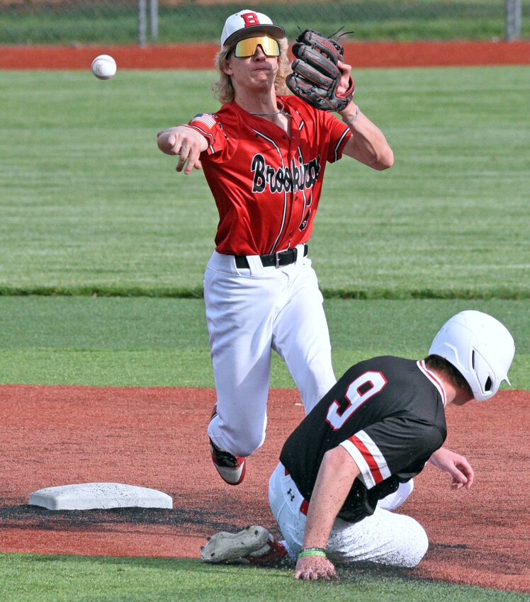 Brookings second baseman Cooper Schneider throws to first base after retiring Yankton's Brennen Gilmore during the first game of their Class A baseball Super Regional series, Saturday at Yankton's Riverside Field at Bob Tereshinski Stadium.