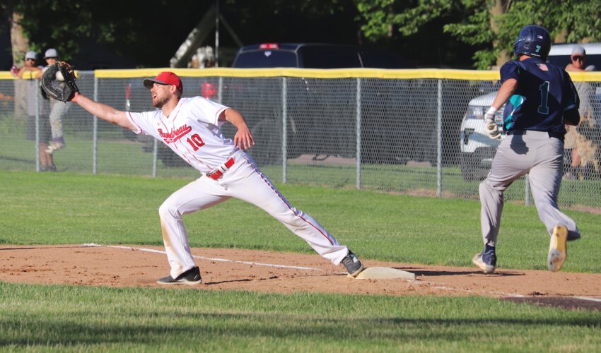 Playing first base Sunday for the Flandreau Cardinals was Luke Gassman. Here he stretches nicely for a throw out against this Mudcat batter.