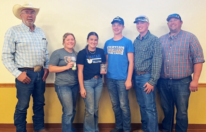 The top Soil Contest 4-H team was Jerauld County 4-H whose members were (left to right) Ella Fagerhaug, Remie Roduner, Kohen Mebius, and Max Klein. Also pictured are Dave Ollila (far left) of the South Dakota Soil Health Coalition and coach, Brady Duxbury (far right). This team will represent S.D. at the National Land and Range Judging Contest in 2026 in Yukon, Okla. 