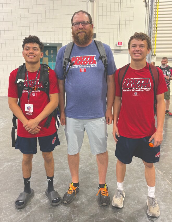 Gabe Frias, Coach Cody Chamblin and Teague Bergjord attended the 2025 AAU Scholastic Duals in Florida.