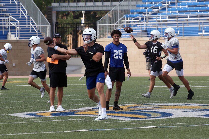 South Dakota State quarterback Chase Mason throws the ball during a practice on Wednesday morning at Dana J. Dykhouse Stadium in Brookings.