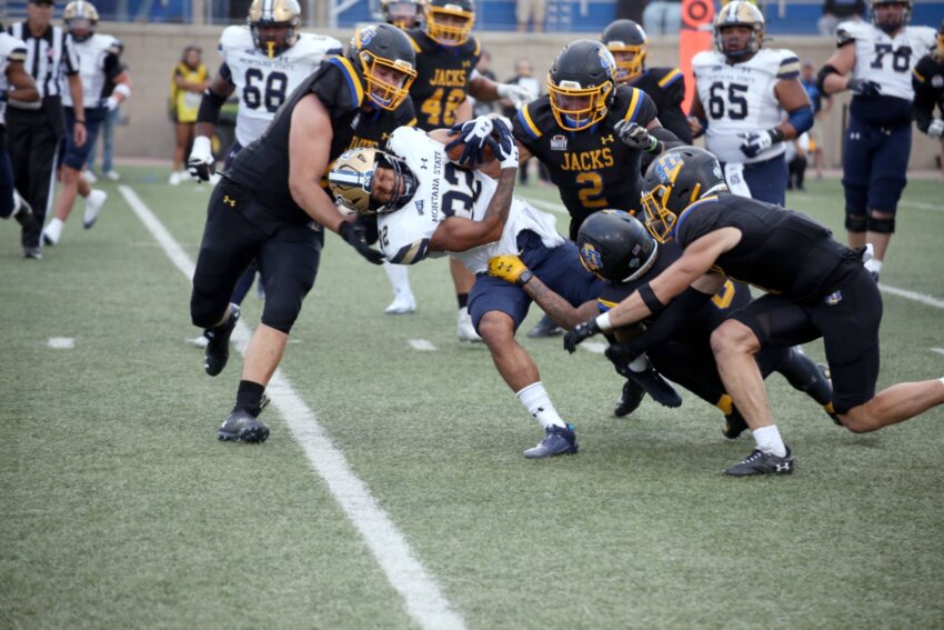 South Dakota State defenders rally around a Montana State ball carrier during a 20-16 Jackrabbit victory at Dana J. Dykhouse Stadium in Brookings on Sept. 9, 2023. The Jackrabbits play Montana State in Bozeman, Mont., on Sept. 6.