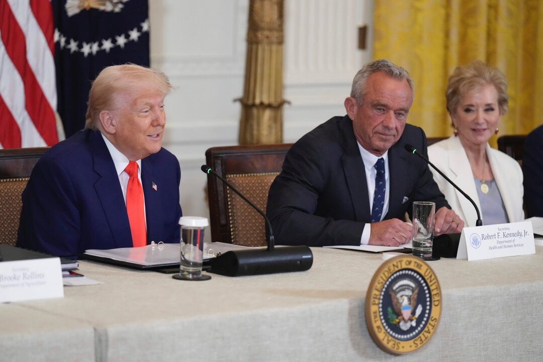 President Donald Trump, left, speaks as Education Secretary Linda McMahon, right, and Health and Human Services Secretary Robert F. Kennedy Jr. listen at a Make America Healthy Again commission event in the East Room of the White House on May 22 in Washington, D.C.